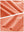Close-up texture of peach pink women's moisture-wicking athletic tennis skirts fabric showing detailed outer and inner lining material.