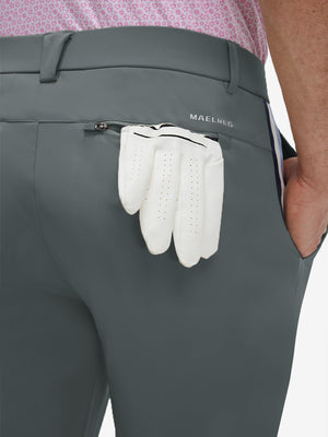 Detail view of back pocket on dark gray breathable casual slacks with 4 pockets