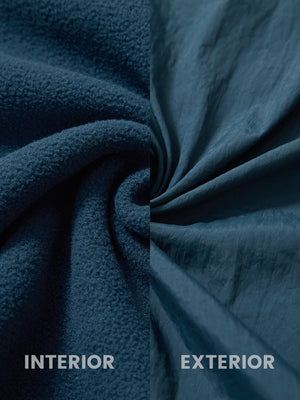 Close-up of inside and outside fabric of dark blue windproof fleece reversible golf vest.