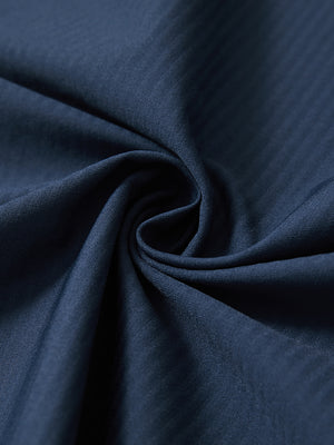 Close-up fabric detail of lightweight water-resistant outerwear jacket, smooth blue indigo texture
