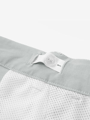 Interior shot of the waistband on the rose dust youth water resistant cotton blend golf pants, showing inner construction