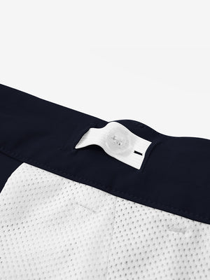 Interior shot of the waistband on the black youth water resistant cotton blend golf pants, showing inner construction