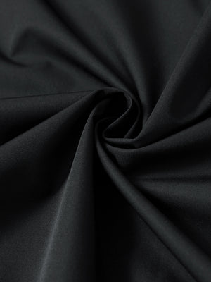 Close-up of black casual windproof bomber jacket fabric, smooth texture and windproof finish