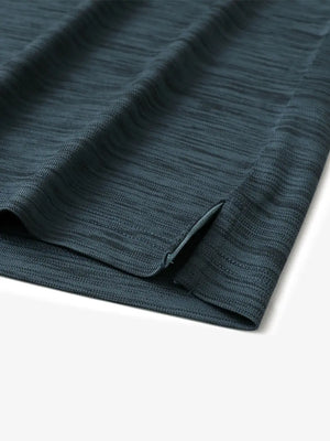 Close-up of hem slit detail in JUNGLE GREEN HEATHER Cool Heather Texture Polo
