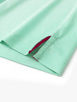 Close-up detail of side hem slit on ICE GREEN Performance Ananas Jacquard Polo