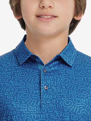 Front view of youth wearing blue graffiti performance print boys golf polo, showing collar and chest fit