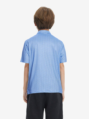 Back half-body view of youth wearing bluejay navy dogs performance print boys golf polo, showing rear design