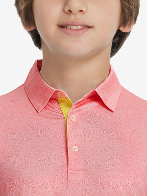Front view of youth wearing candy pink line performance print boys golf polo, showing collar and chest fit