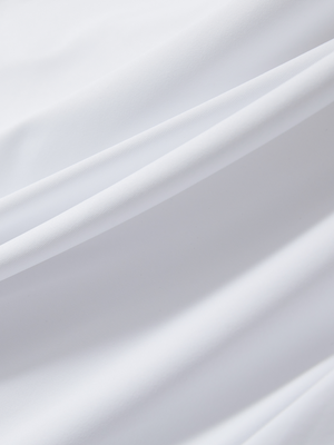Close-up of white Moisture-Wicking Short Sleeve Henley Shirt fabric texture.