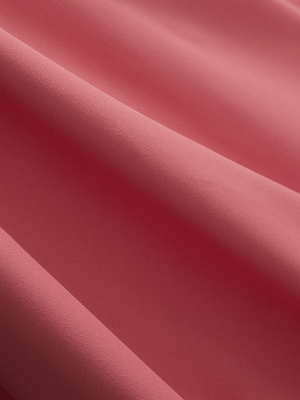 Close-up of brick red Moisture-Wicking Short Sleeve Henley Shirt fabric texture.