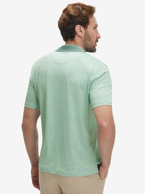 Back half-body of model in green abstract lines lightweight stretch upgraded print golf polo shirts