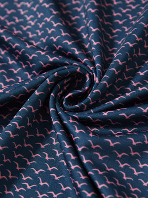 Close-up fabric detail of lightweight print long sleeve polo, breathable texture and soft feel in navy pink seagull