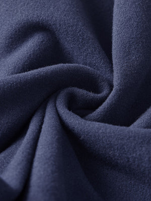 Fabric close-up of navy boys stretch fleece lined casual golf pants, soft stretch fabric with warm fleece lining.