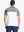 Back half-body view wearing WHITE Premium Performance Polo